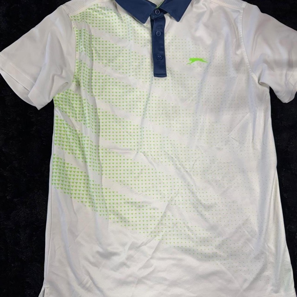 Slazenger white polo shirt with green diagonal stripes and dot pattern